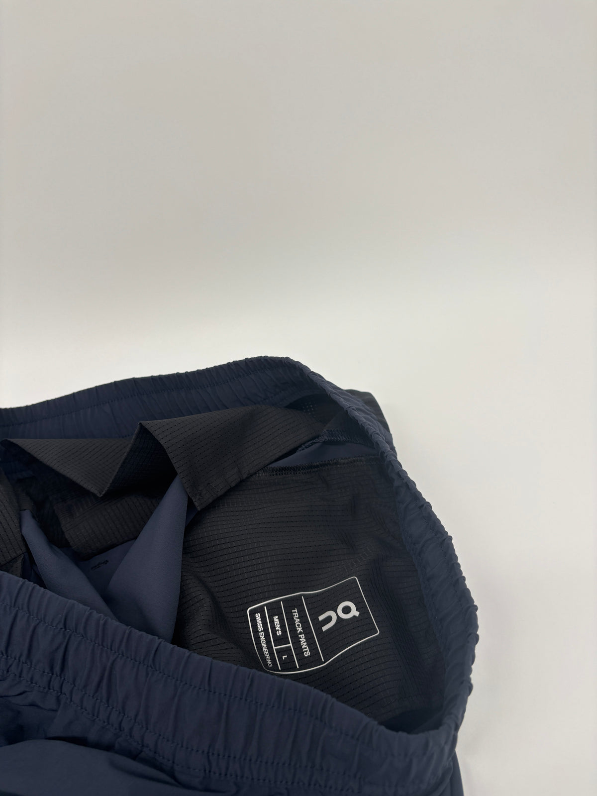 ON RUNNING TRACK PANTS