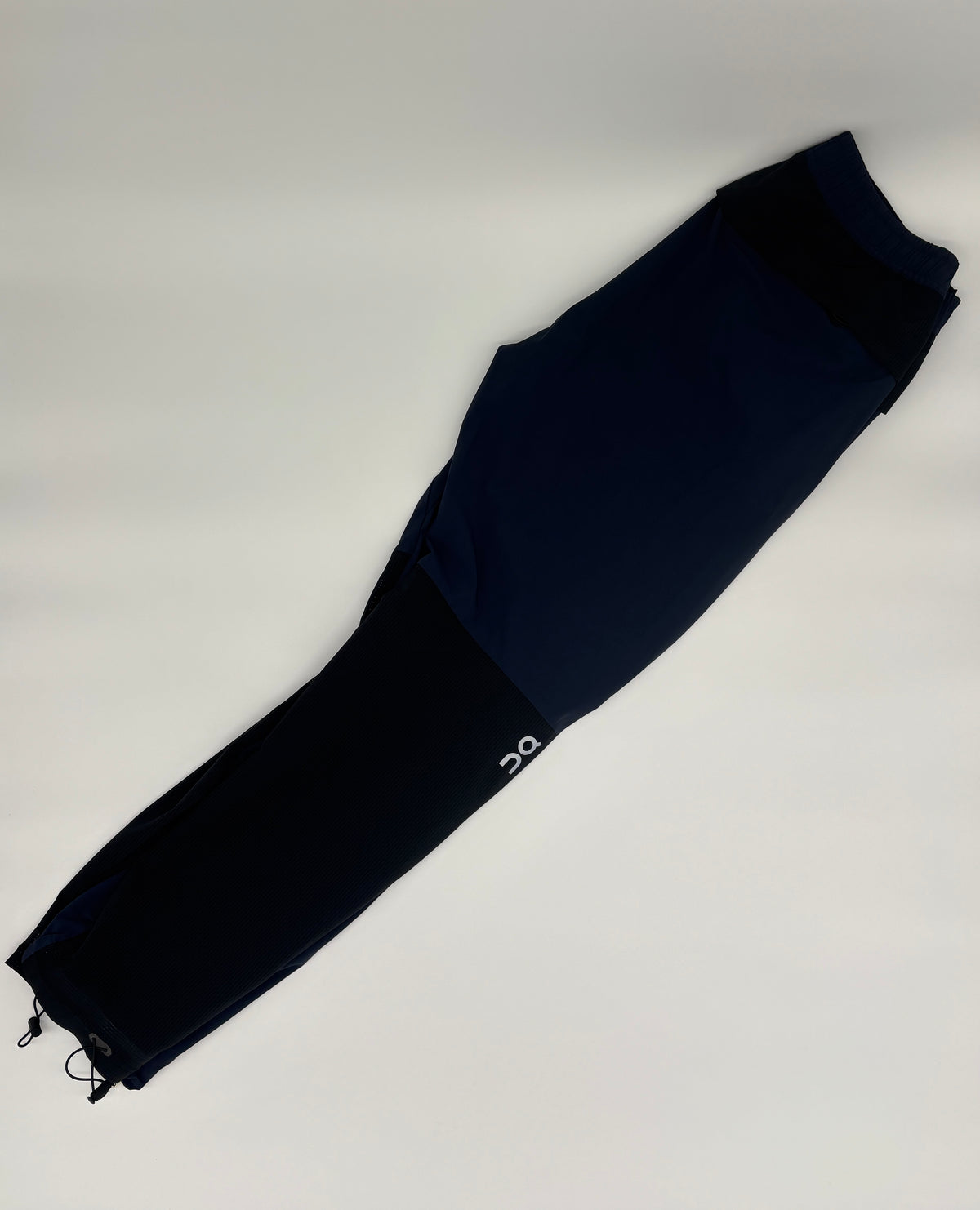 ON RUNNING TRACK PANTS