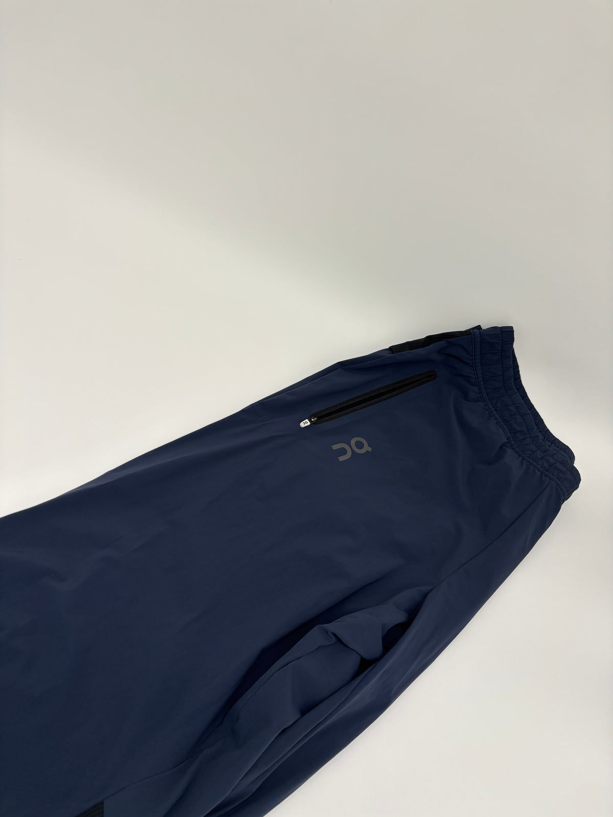 ON RUNNING TRACK PANTS