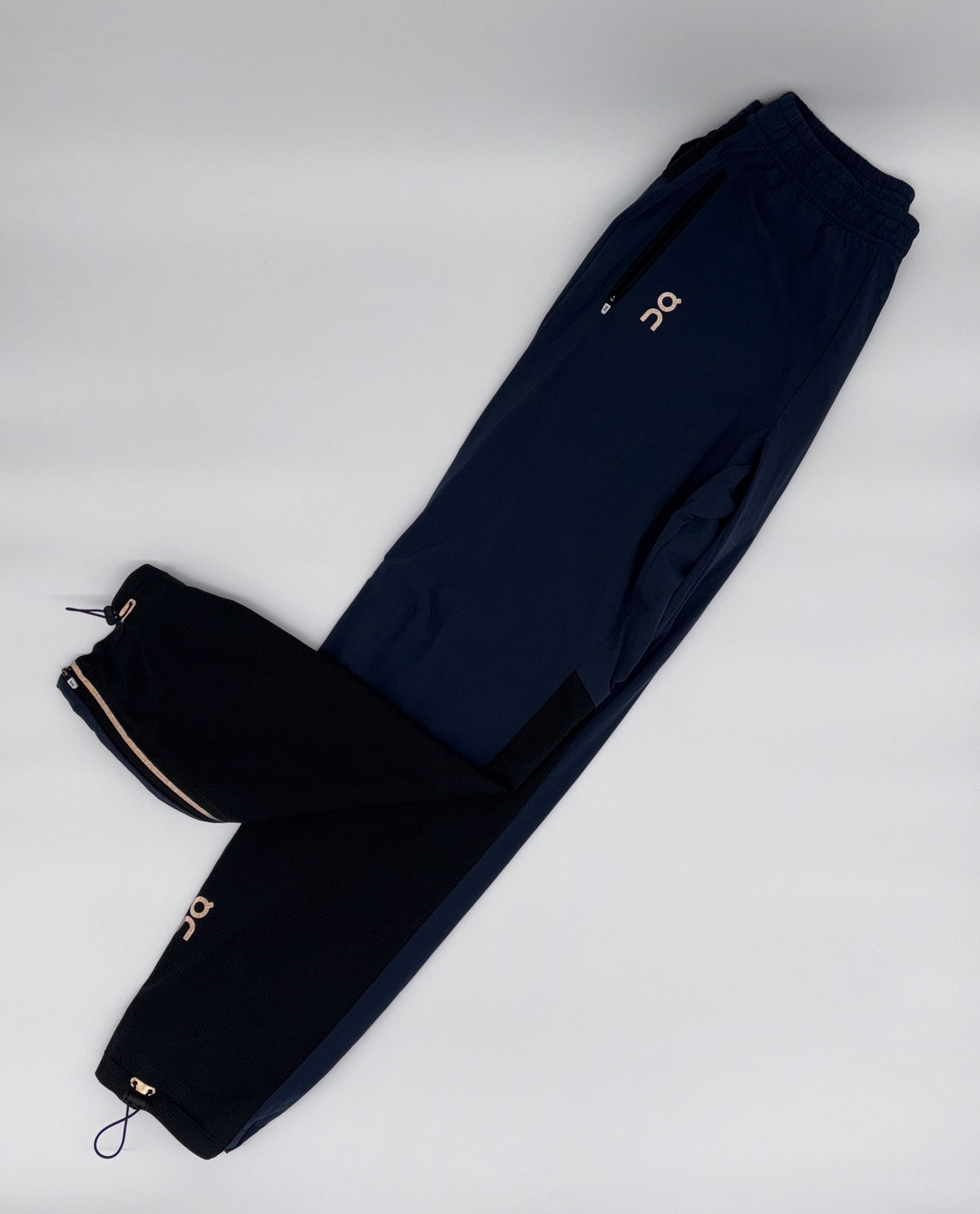 ON RUNNING TRACK PANTS